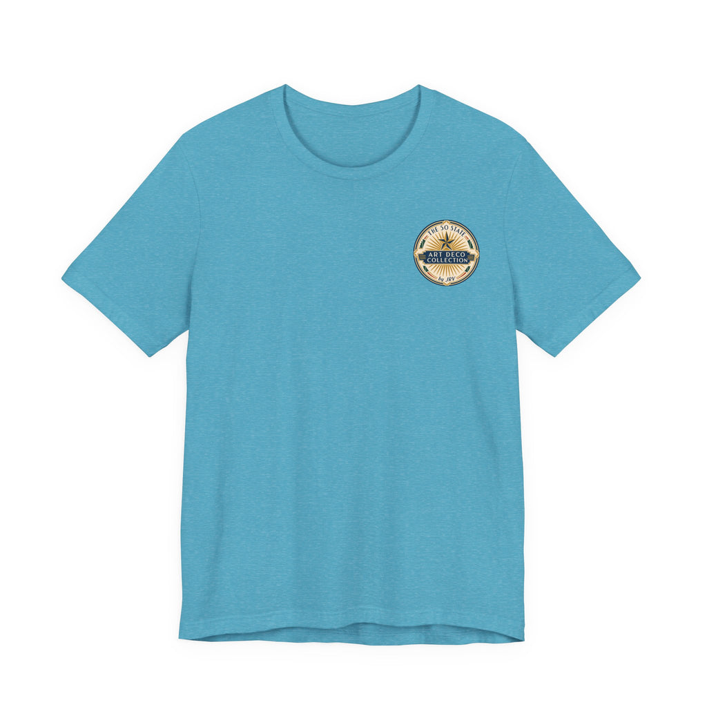 Light blue T-shirt with short sleeves and small circular chest logo patch.