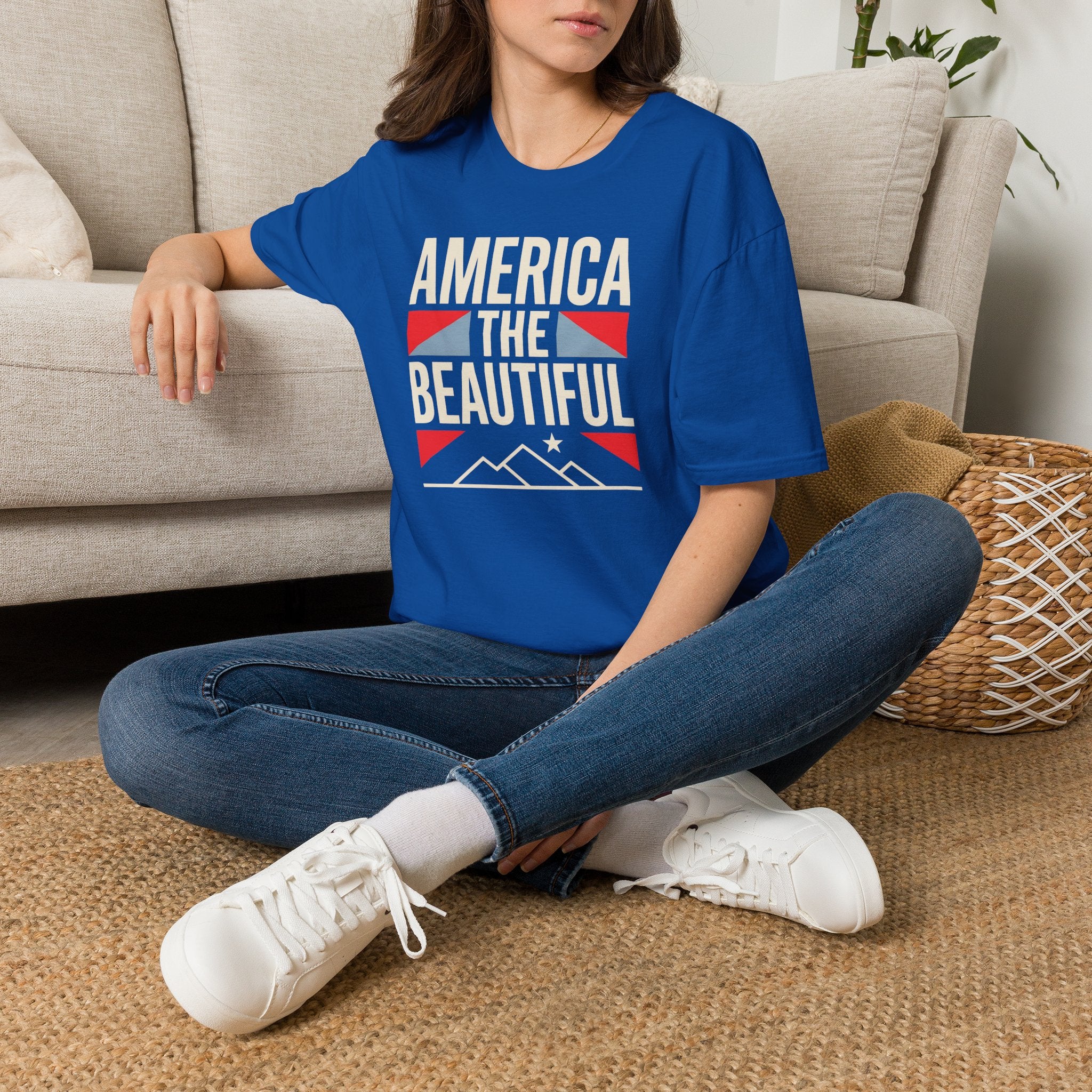 Royal blue short-sleeve T-shirt with “AMERICA THE BEAUTIFUL” graphic and flag design.