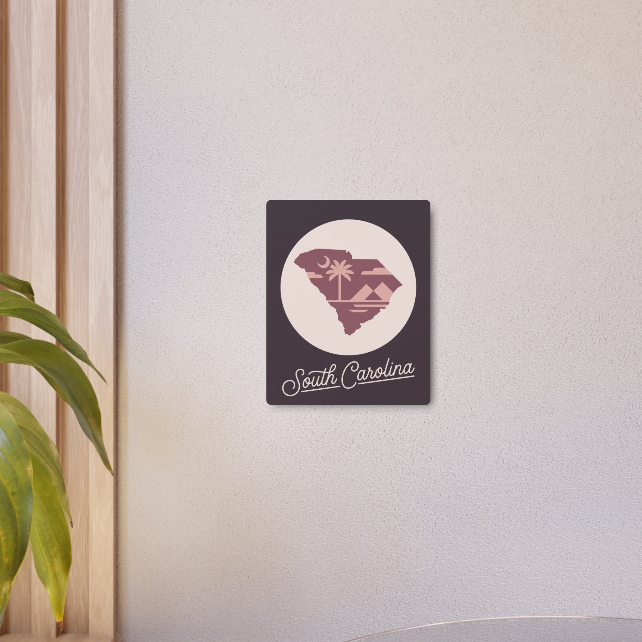 Small mauve square metal wall art with circular South Carolina silhouette and script lettering