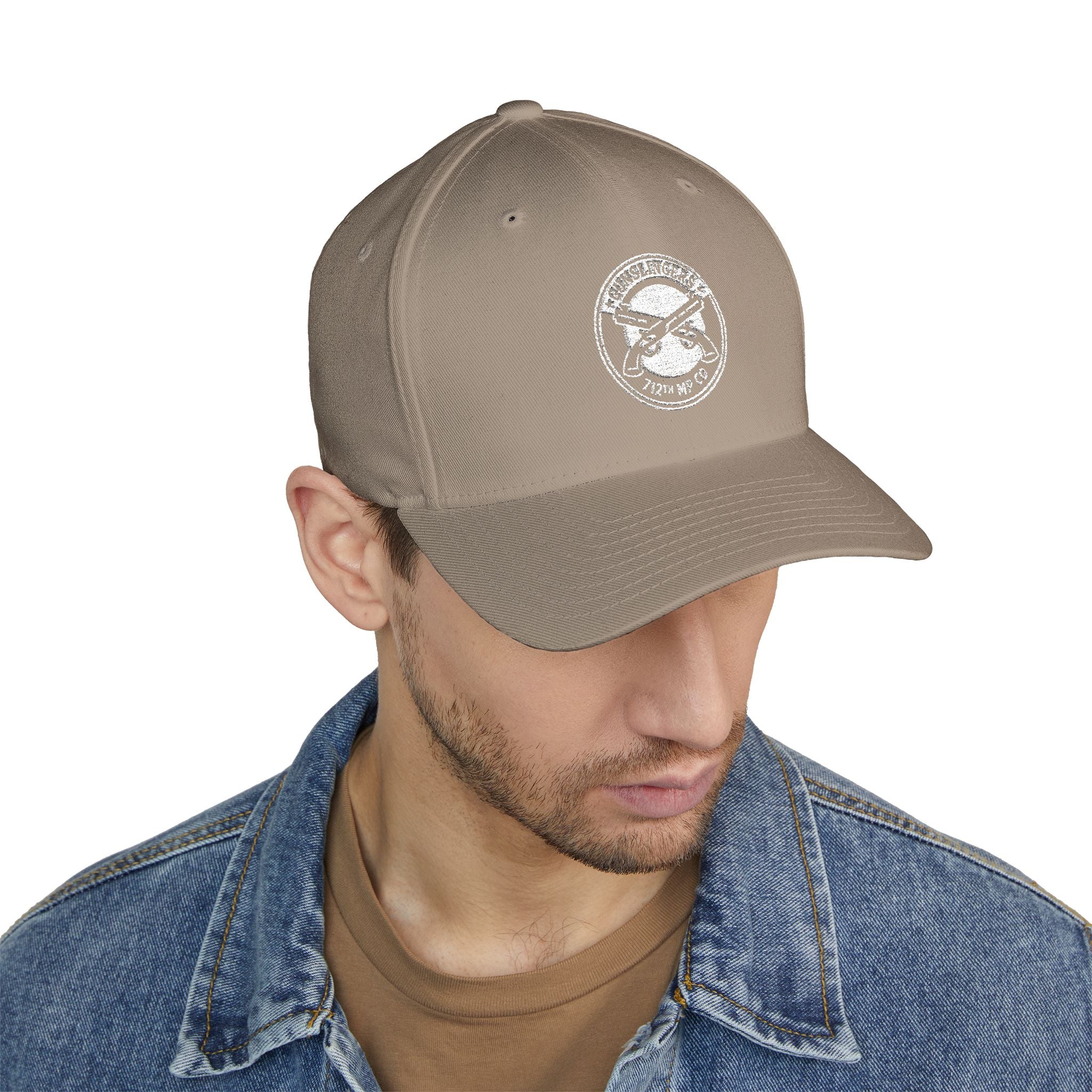 Embroidered khaki baseball cap with round white emblem on front