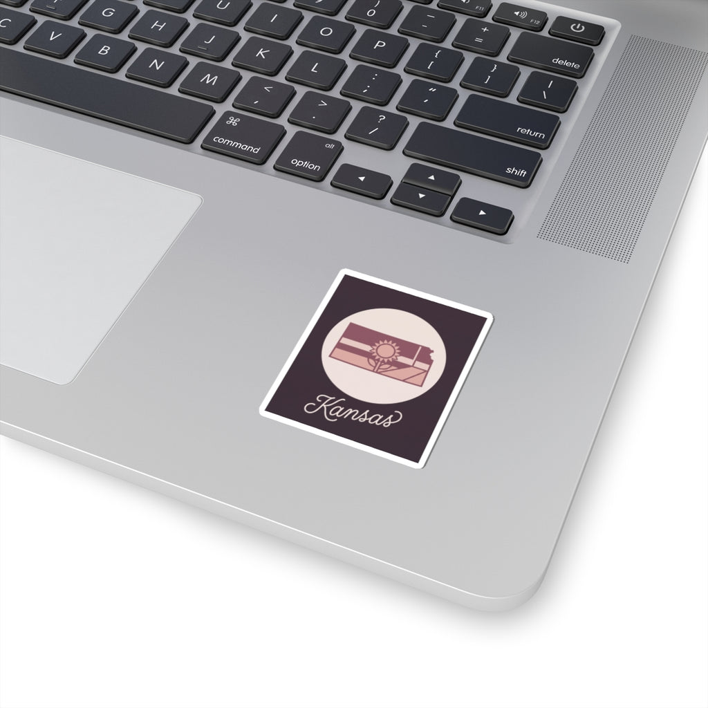 Mauve Kansas state silhouette vinyl sticker with white border and kiss-cut backing