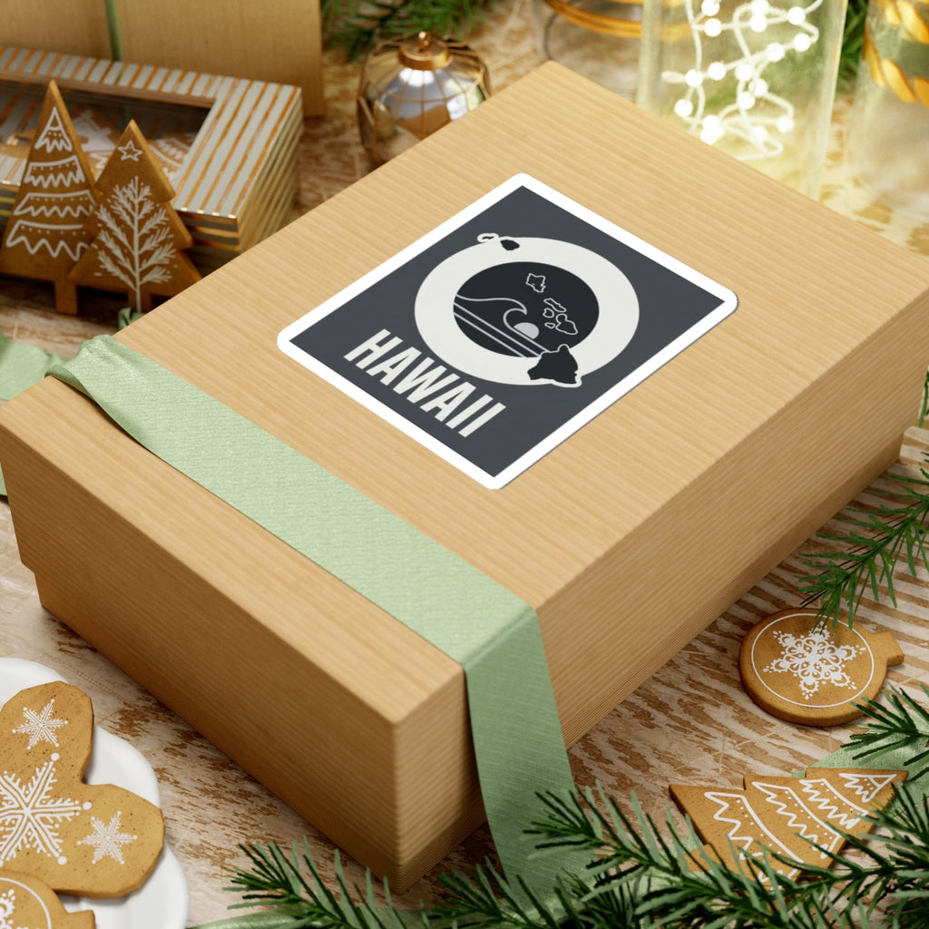 Square kiss-cut sticker on gift wrap, white-bordered black wave emblem with HAWAII text