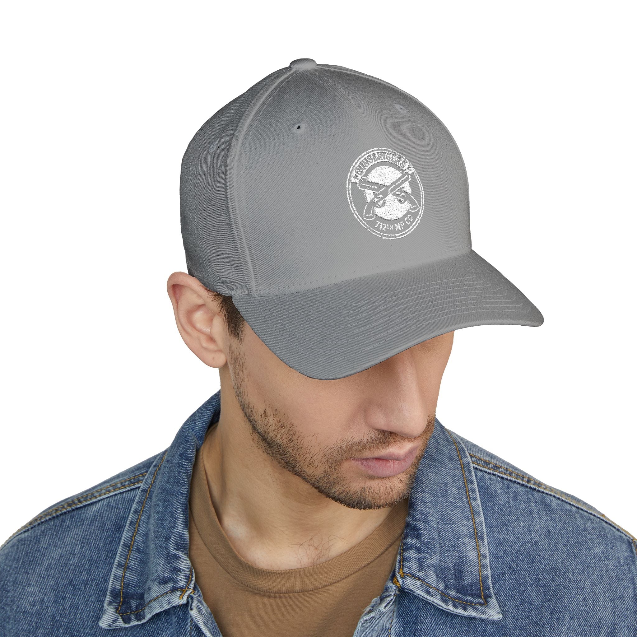 Light grey embroidered baseball cap with circular white emblem on front