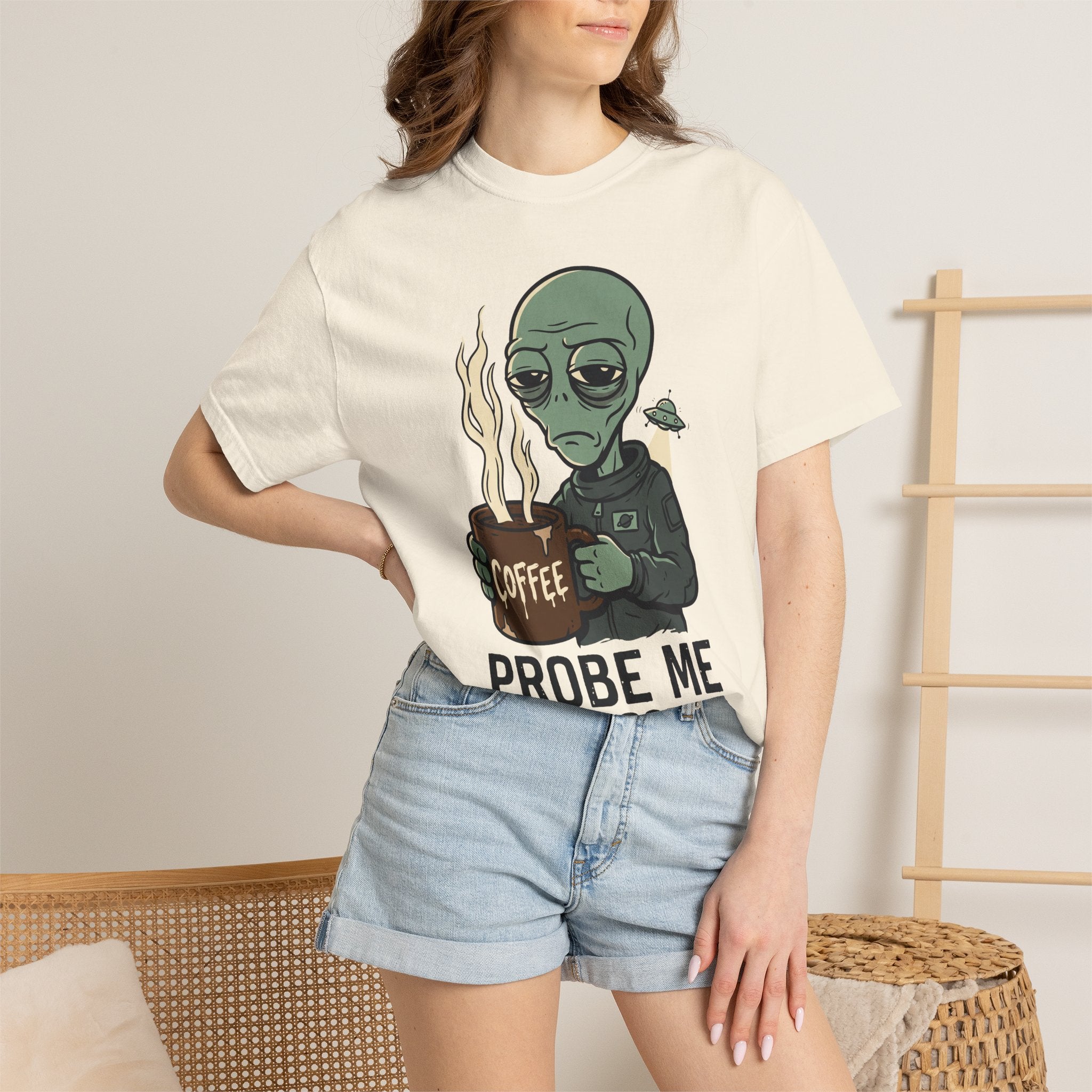 Light cream alien coffee graphic T-shirt on model, short sleeves, crew neck.