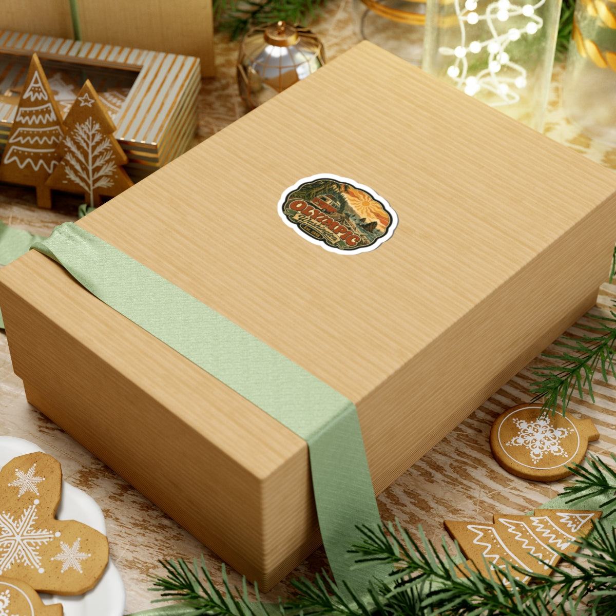 Olympic National Park badge sticker on tan gift box with green ribbon