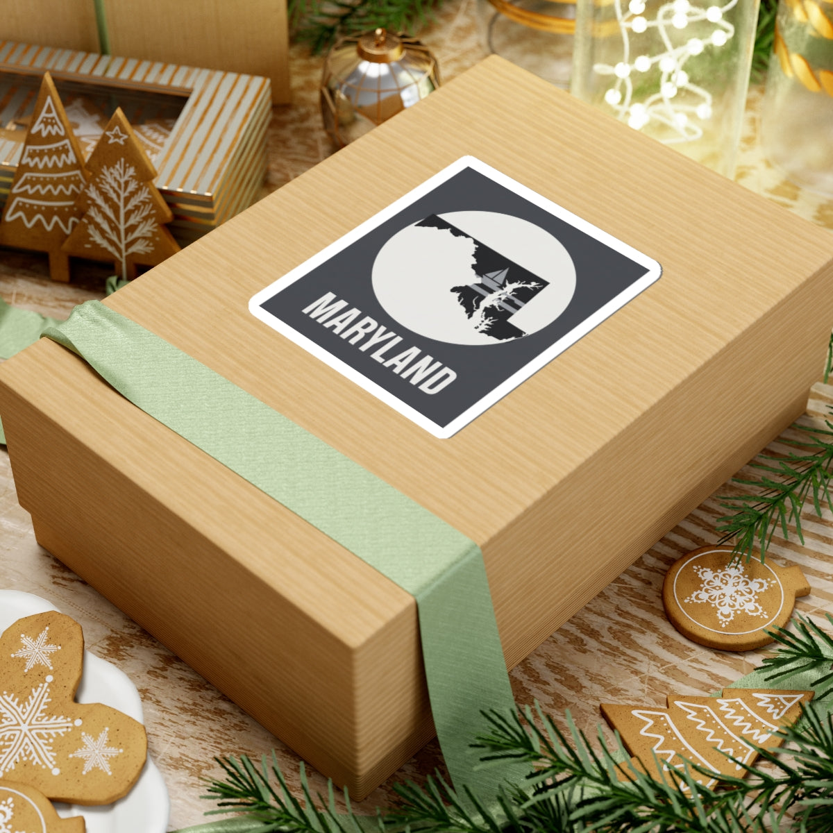 Maryland kiss-cut sticker on a wrapped gift, with white circle state shape and “MARYLAND”