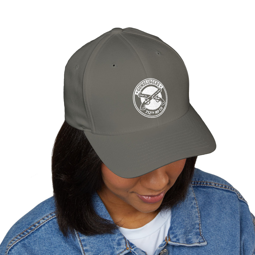 Embroidered dark gray/black baseball cap with round white emblem on front