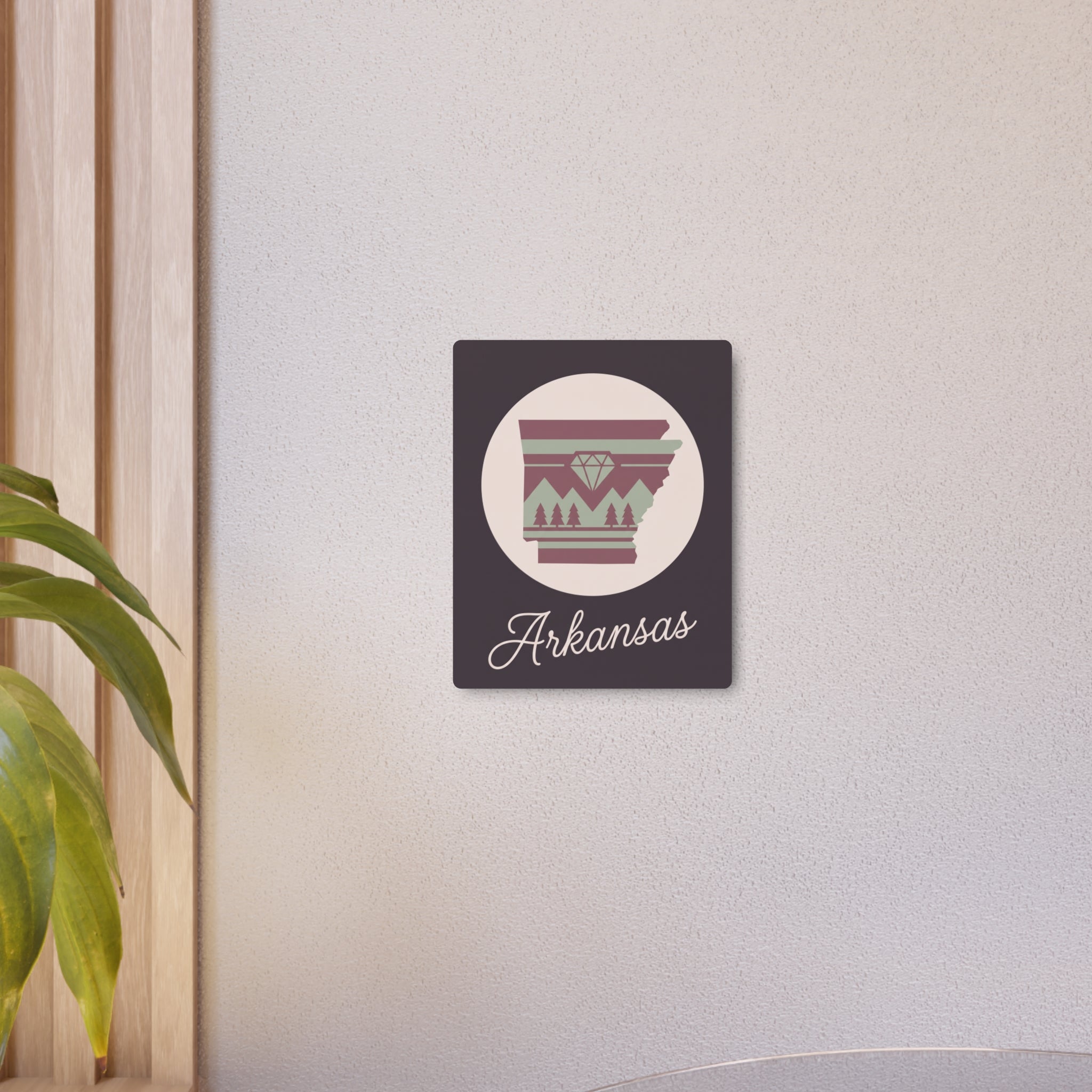 Small Arkansas silhouette metal wall art sign with mauve and sage emblem on dark purple square