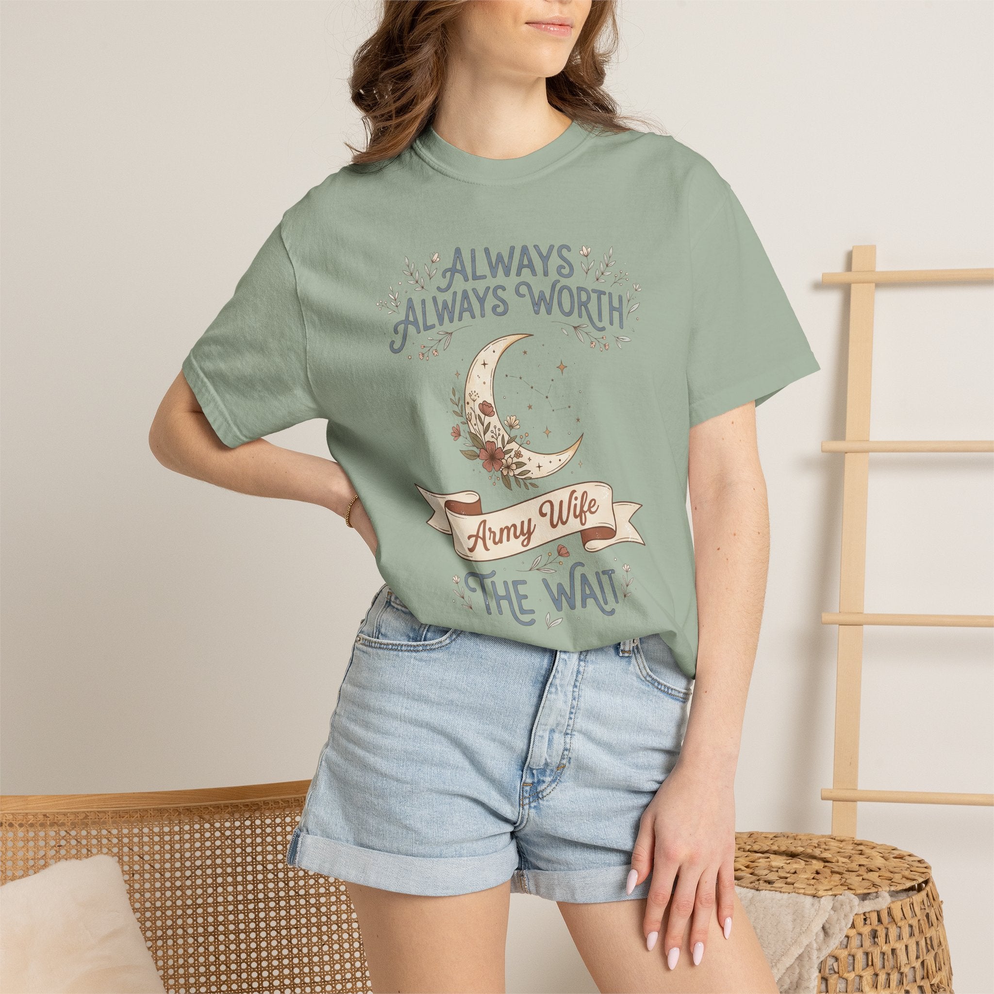 T-shirt in sage green with moon and “ALWAYS WORTH THE WAIT” graphic, worn by model.