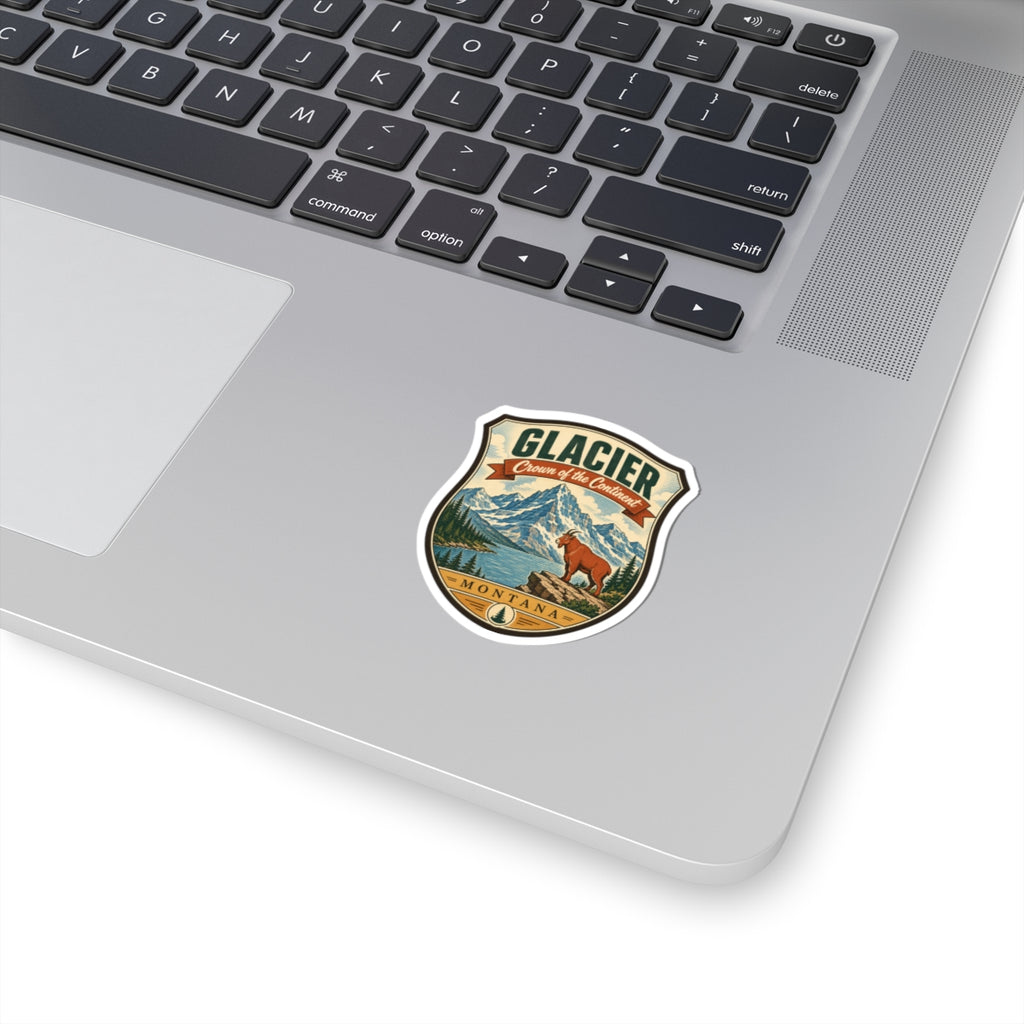 Glacier National Park shield travel sticker with mountain landscape and orange bear