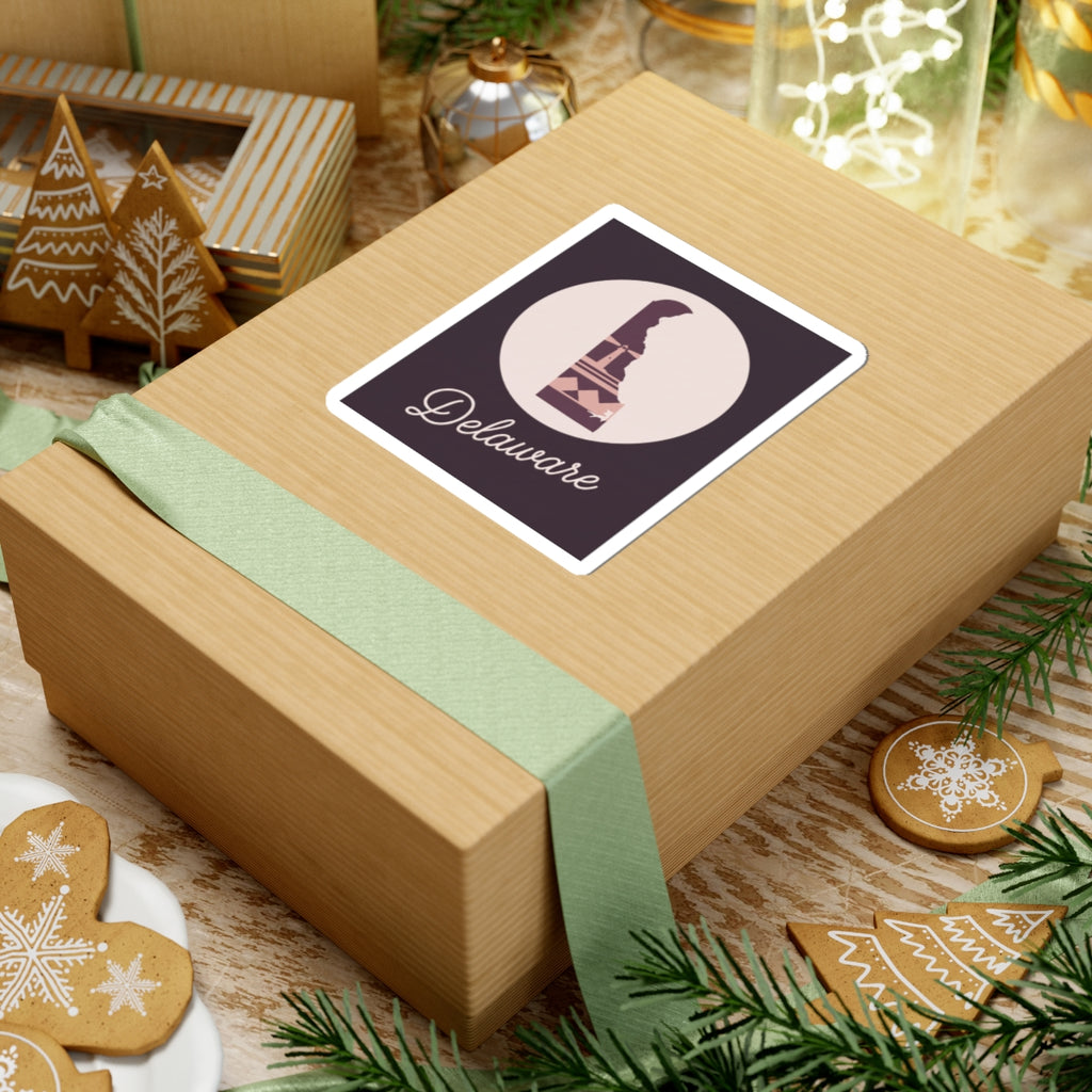 Delaware silhouette vinyl sticker on gift box, mauve lighthouse and 'Delaware' script in circle