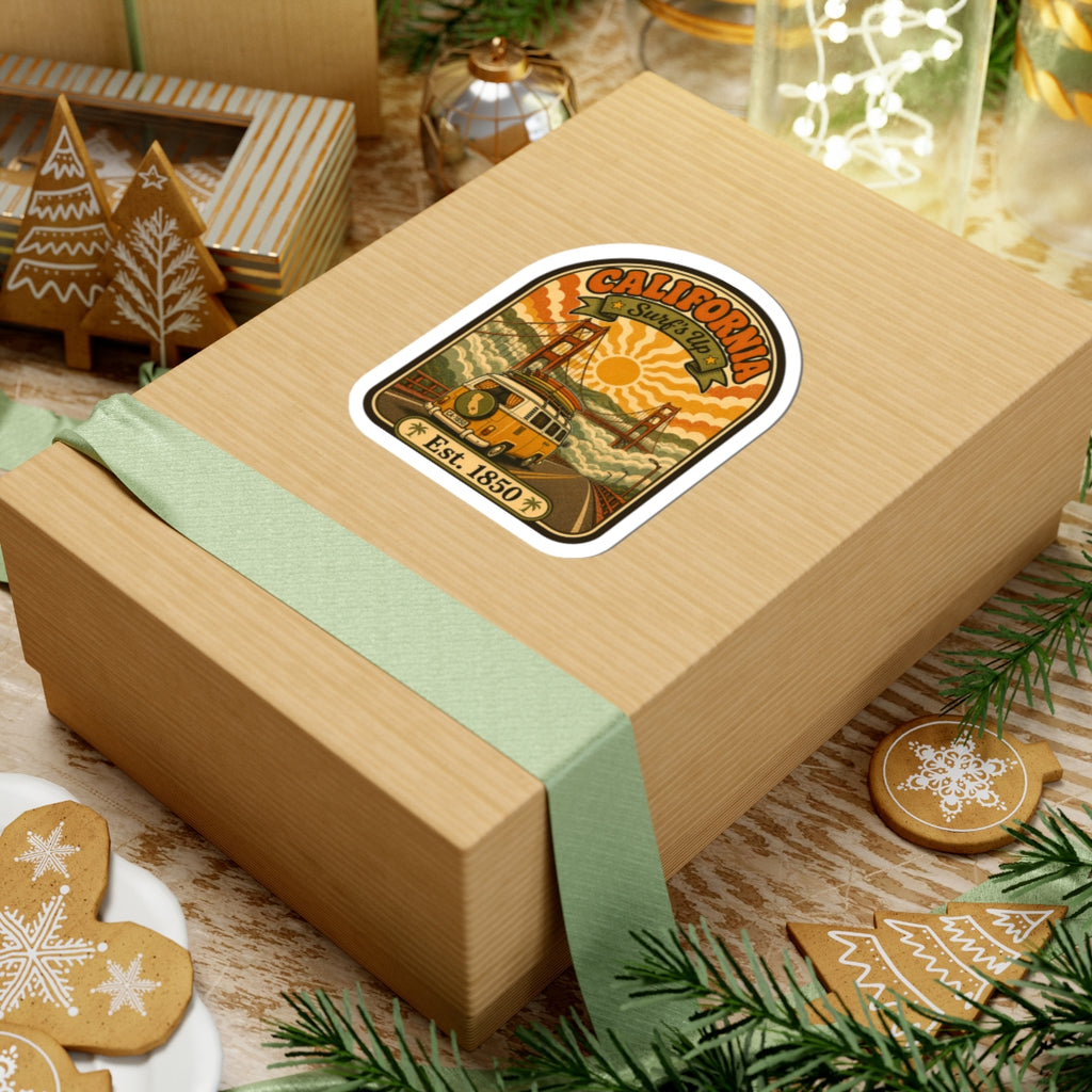 Retro California surf van sticker on a gift box lid with bridge and “Est. 1850” text.