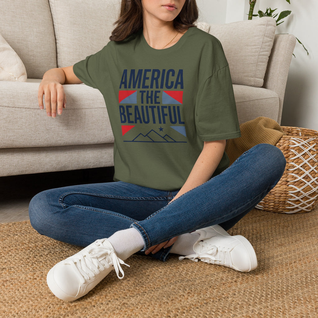 Military green crewneck t-shirt with “AMERICA THE BEAUTIFUL” front graphic print.