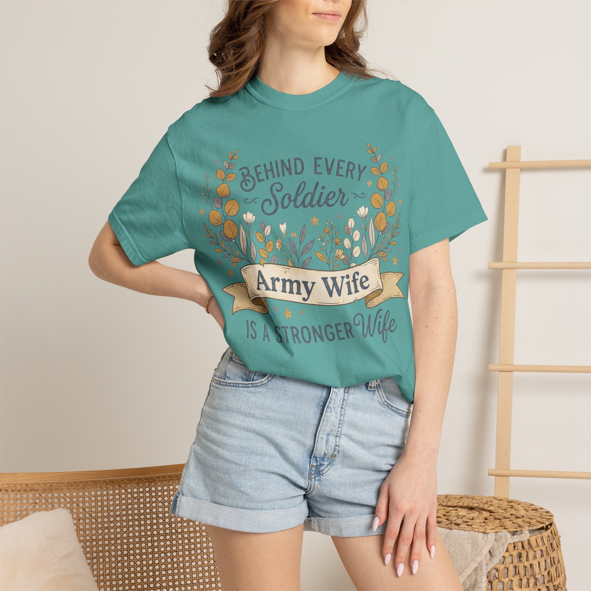 Teal T-shirt worn by model with floral wreath and 'Army Wife' text