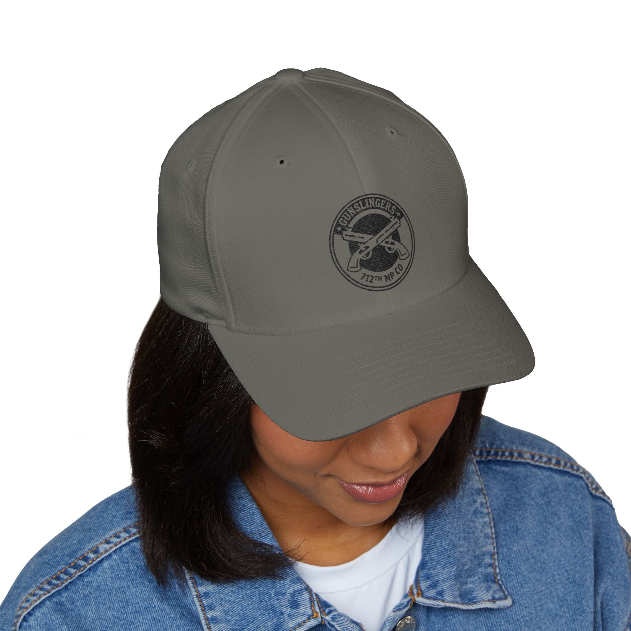 Gray baseball cap with circular black embroidered emblem