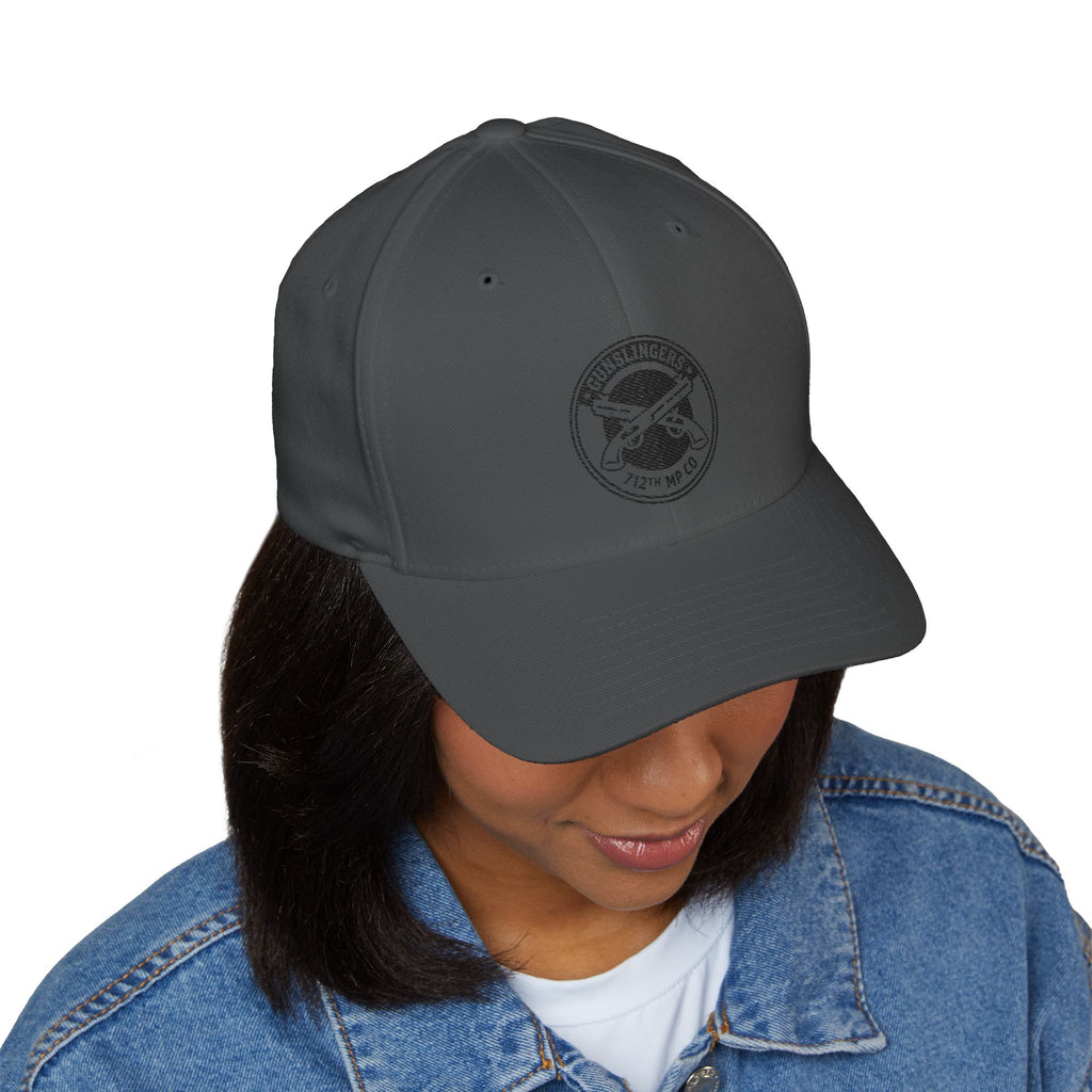Dark gray baseball cap with circular black embroidered emblem