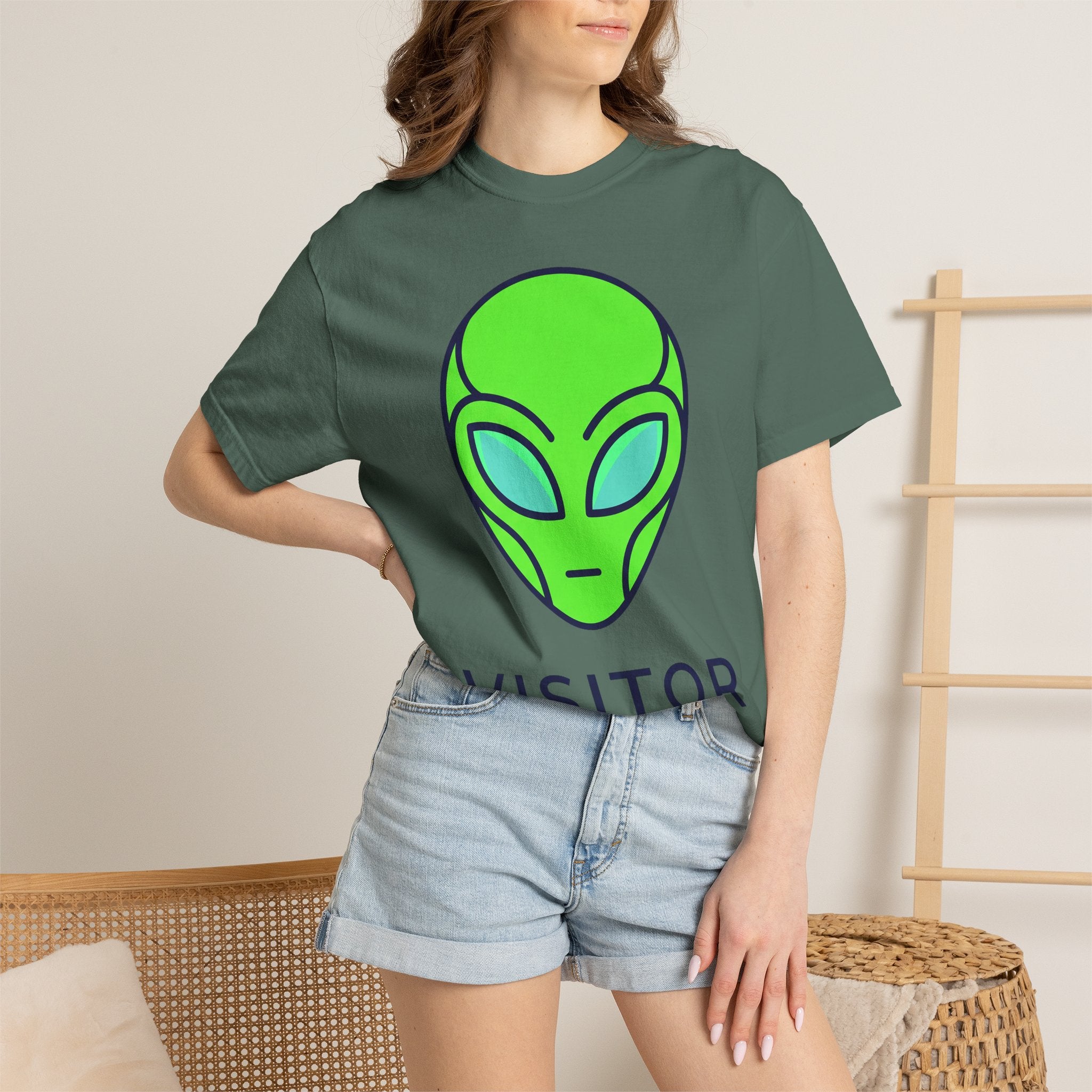 Olive green T-shirt with neon alien face graphic