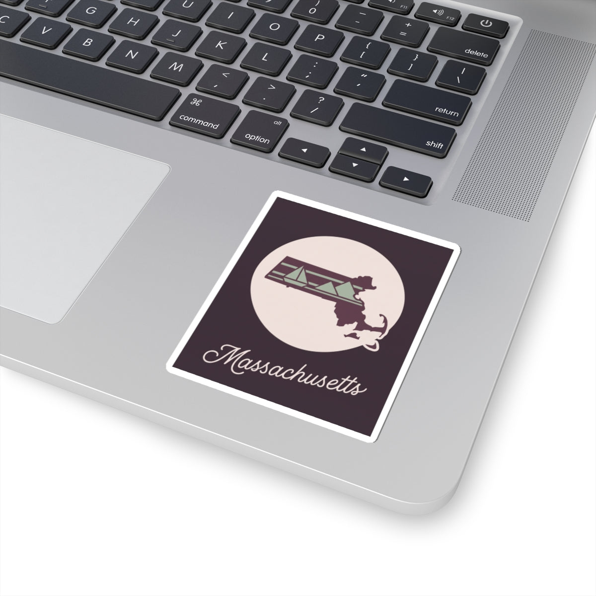 Massachusetts vinyl decal sticker on a laptop surface, dark purple design with script text
