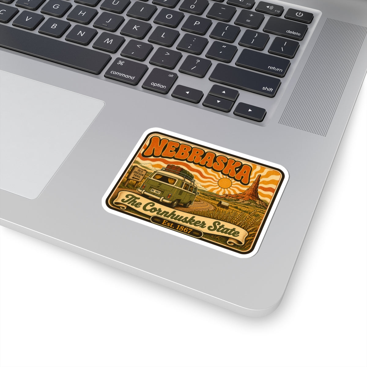 Nebraska vintage van kiss-cut sticker on laptop with white border and Est. 1867