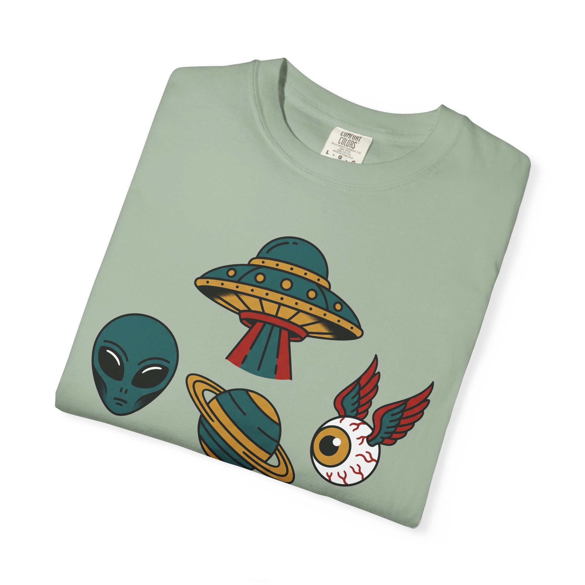 Light green T-shirt with alien, UFO, and red-winged cat graphic printed across front