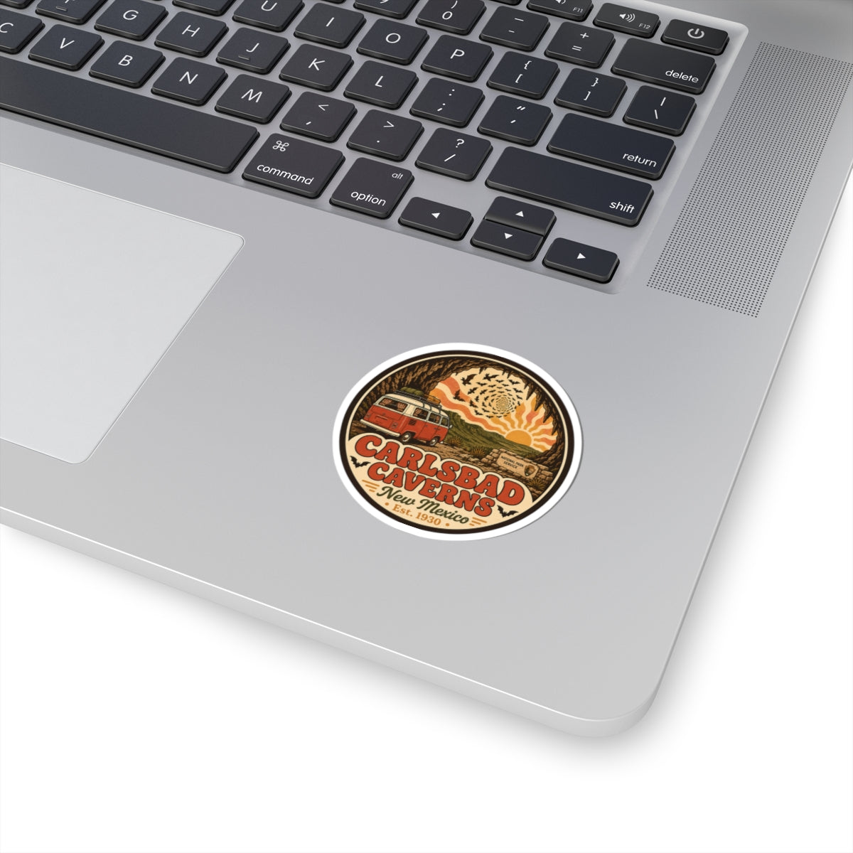Round vintage desert park sticker with brown border and stylized cave entrance graphic