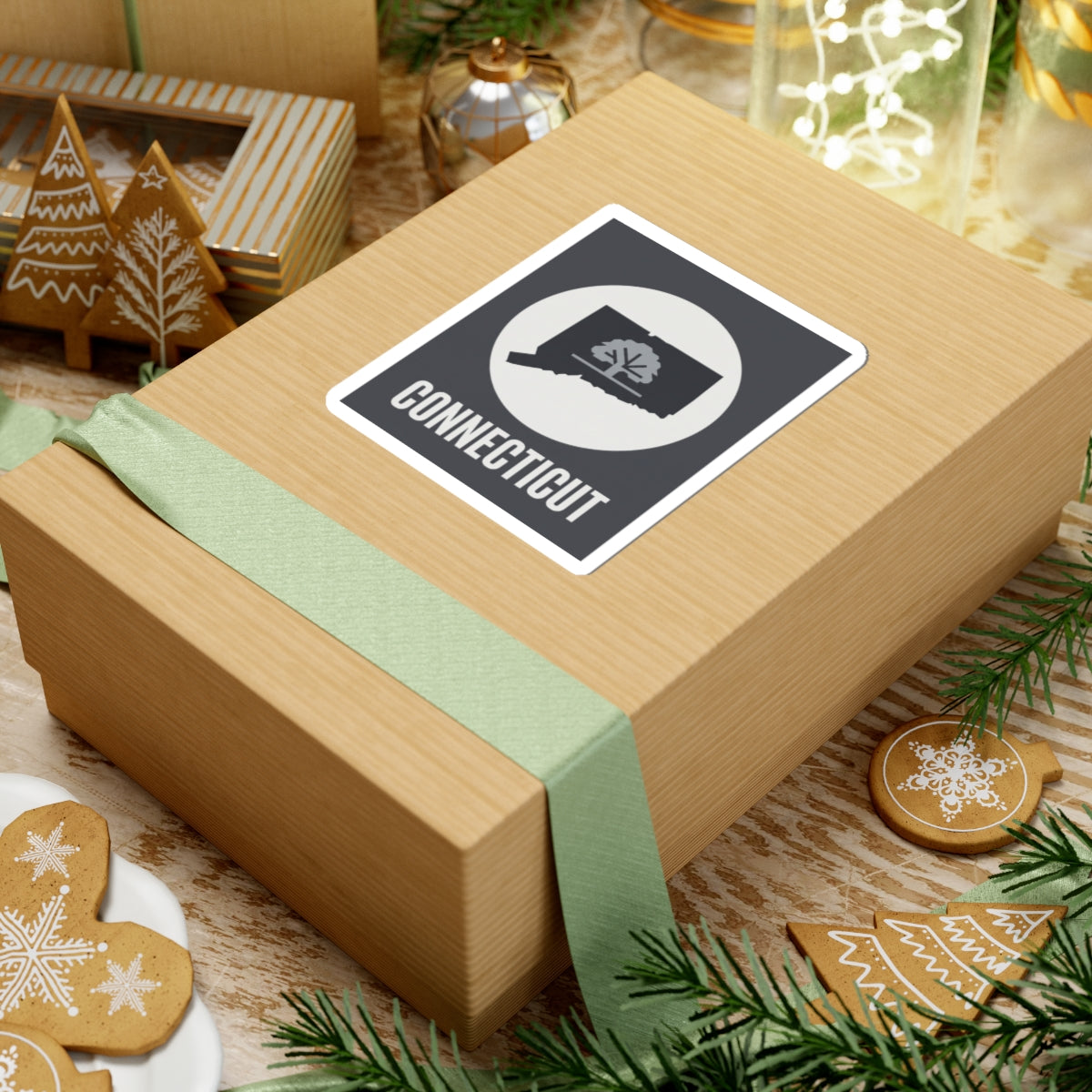 Connecticut tree silhouette kiss-cut sticker on a wrapped gift box, white circle and CONNECTICUT