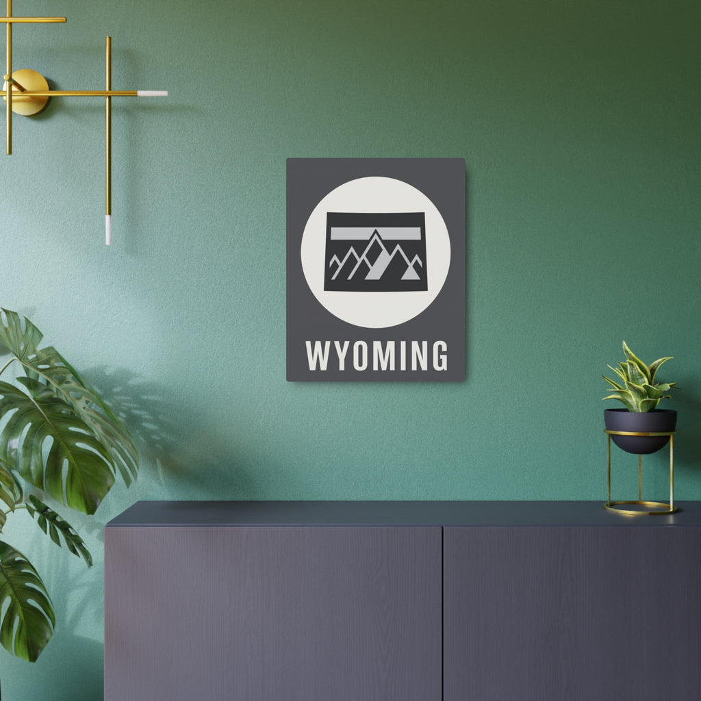 Metal Wyoming wall sign with circular mountain badge on dark square backing