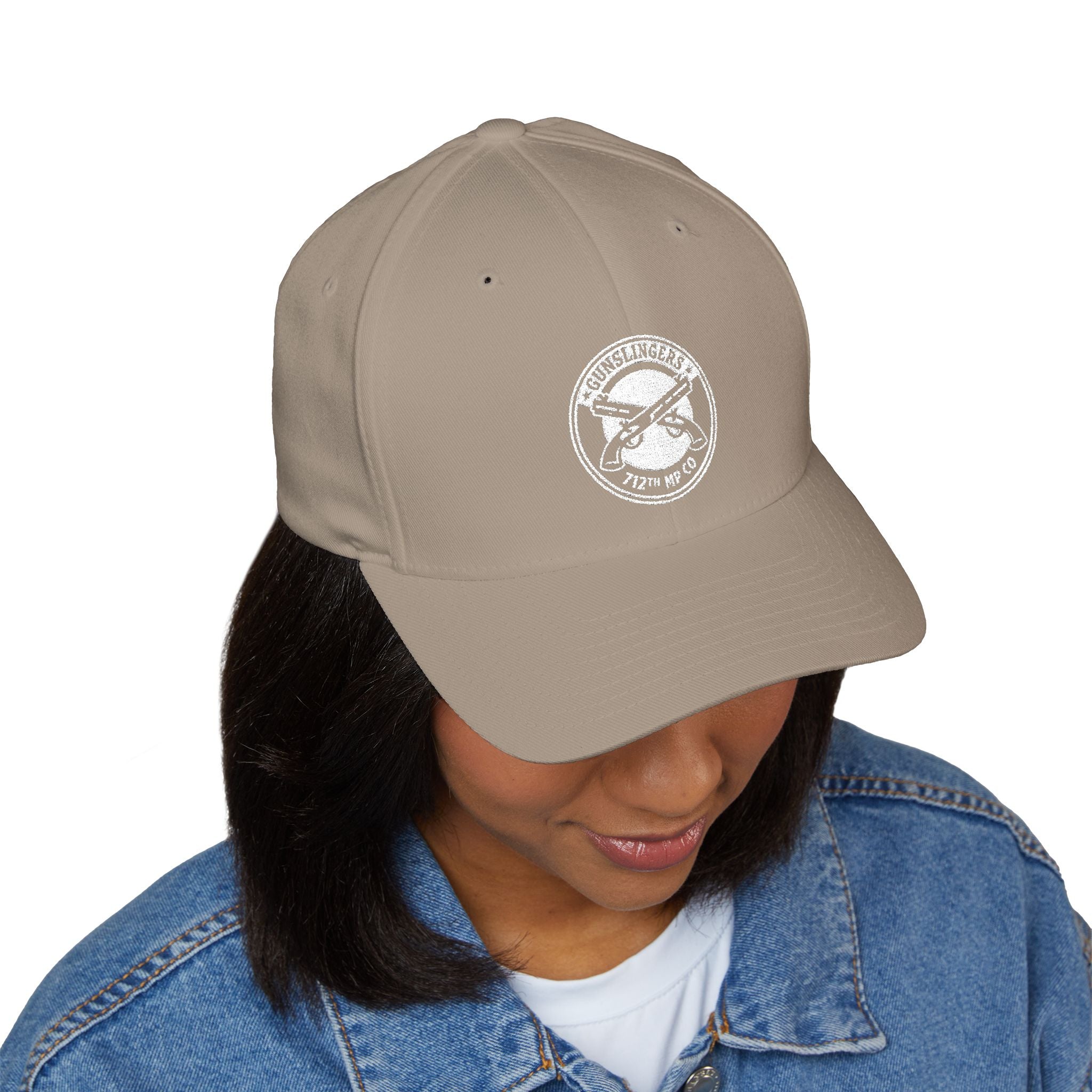 Embroidered khaki baseball cap with round white emblem on front