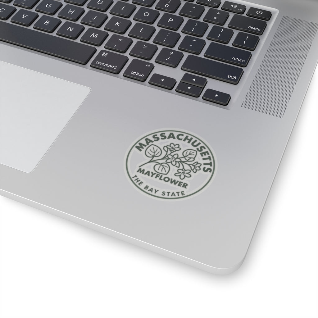 Massachusetts Mayflower state flower circular sticker on a laptop lid, gray text and botanical