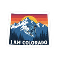 I Am Colorado sticker with snowboarder and pine trees, white border and “I AM COLORADO”