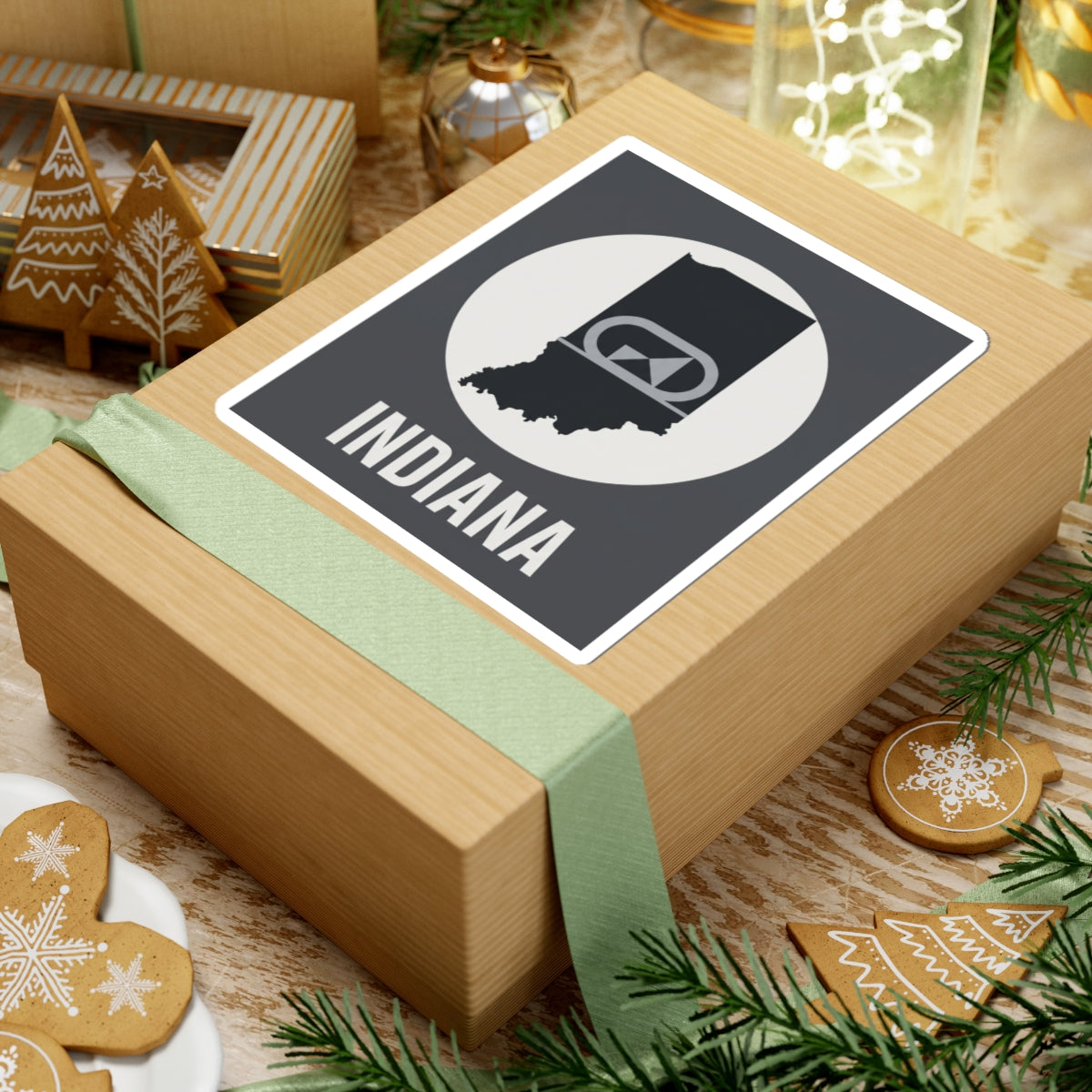 Indiana sticker on wrapped gift box, black-and-white circular badge with “INDIANA”