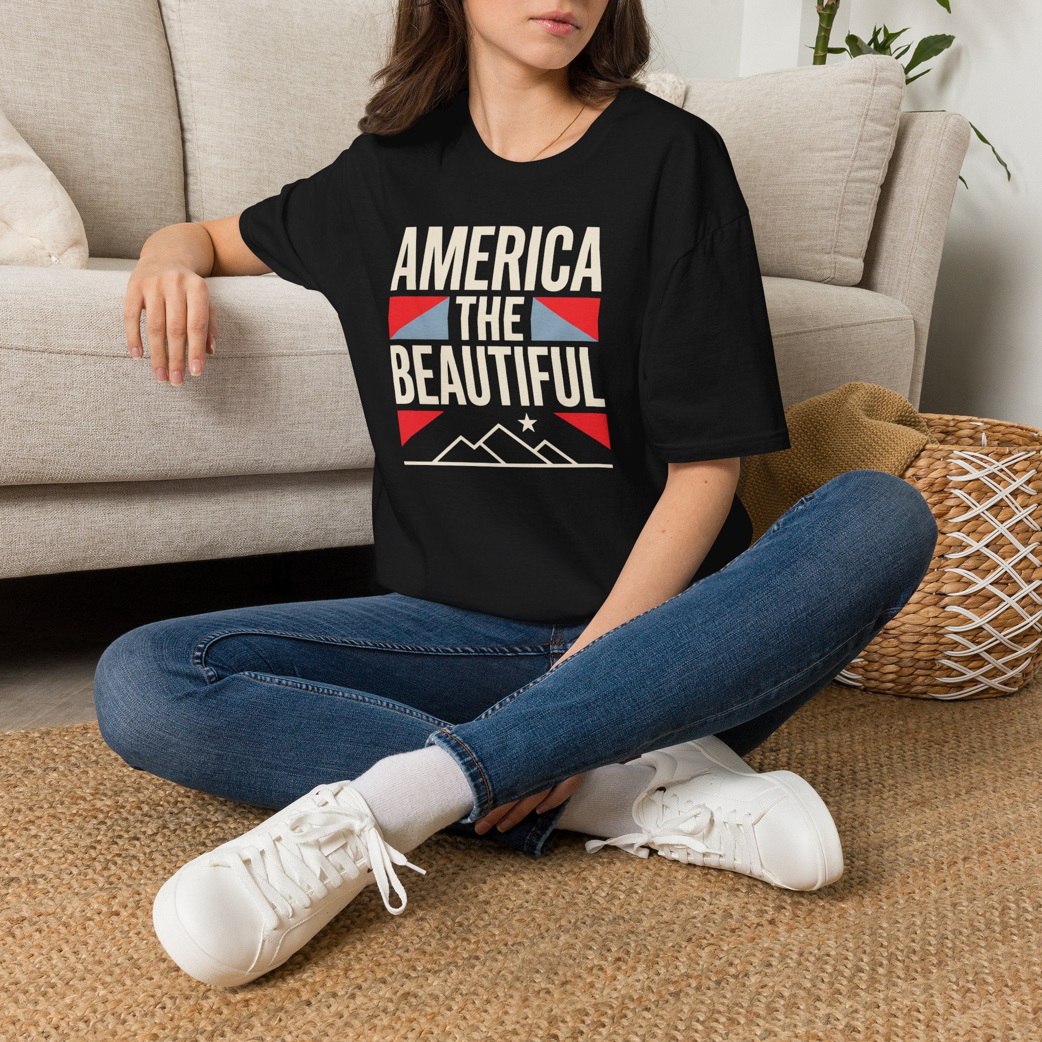 Black T-shirt worn by model with 'AMERICA THE BEAUTIFUL' patriotic graphic