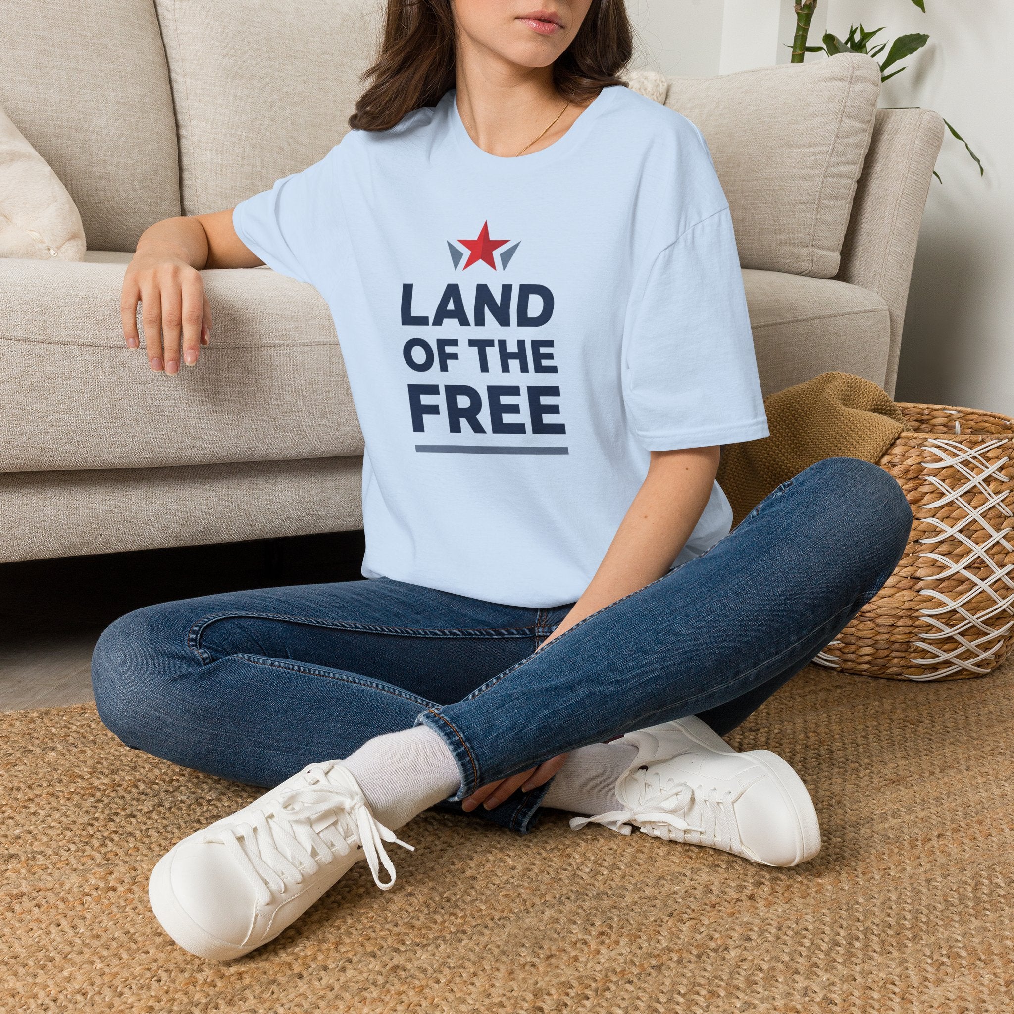 Light blue short-sleeve T-shirt with “LAND OF THE FREE” text and red star