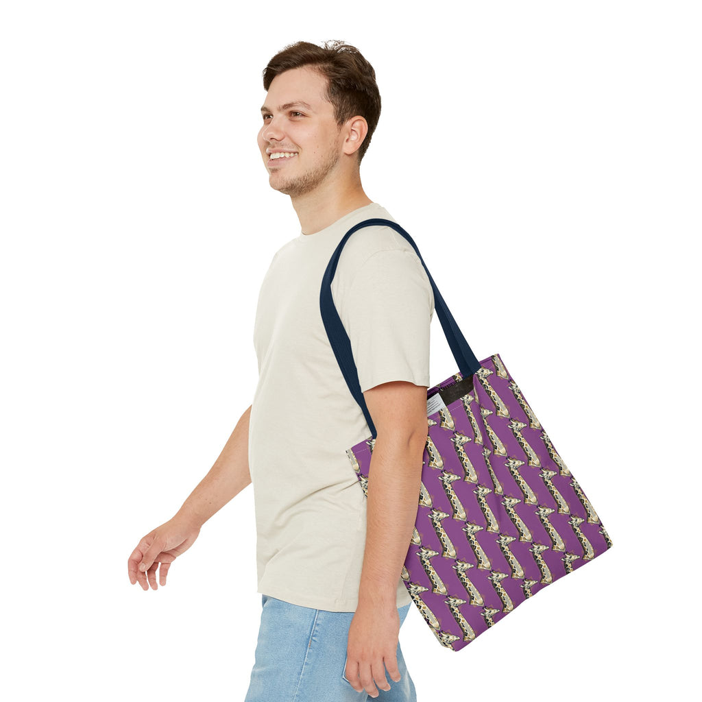 Purple tote bag with saxophone pattern and navy handles, worn over shoulder.