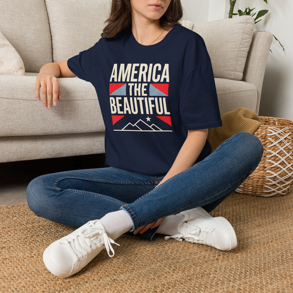 Dark navy short-sleeve T-shirt with “AMERICA THE BEAUTIFUL” graphic and flag design.