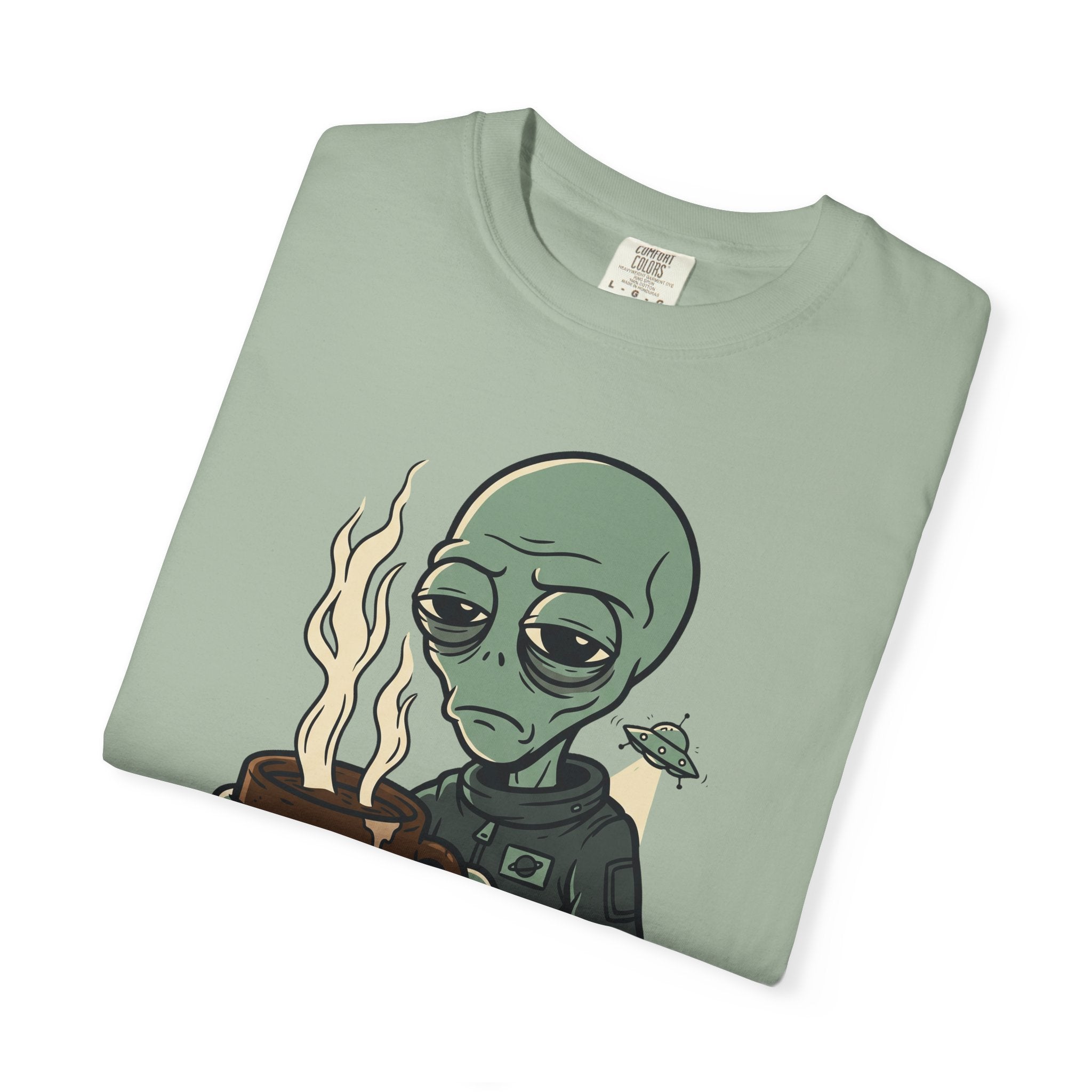 Sage green short-sleeve T-shirt with alien and coffee “PROBE ME” graphic on chest
