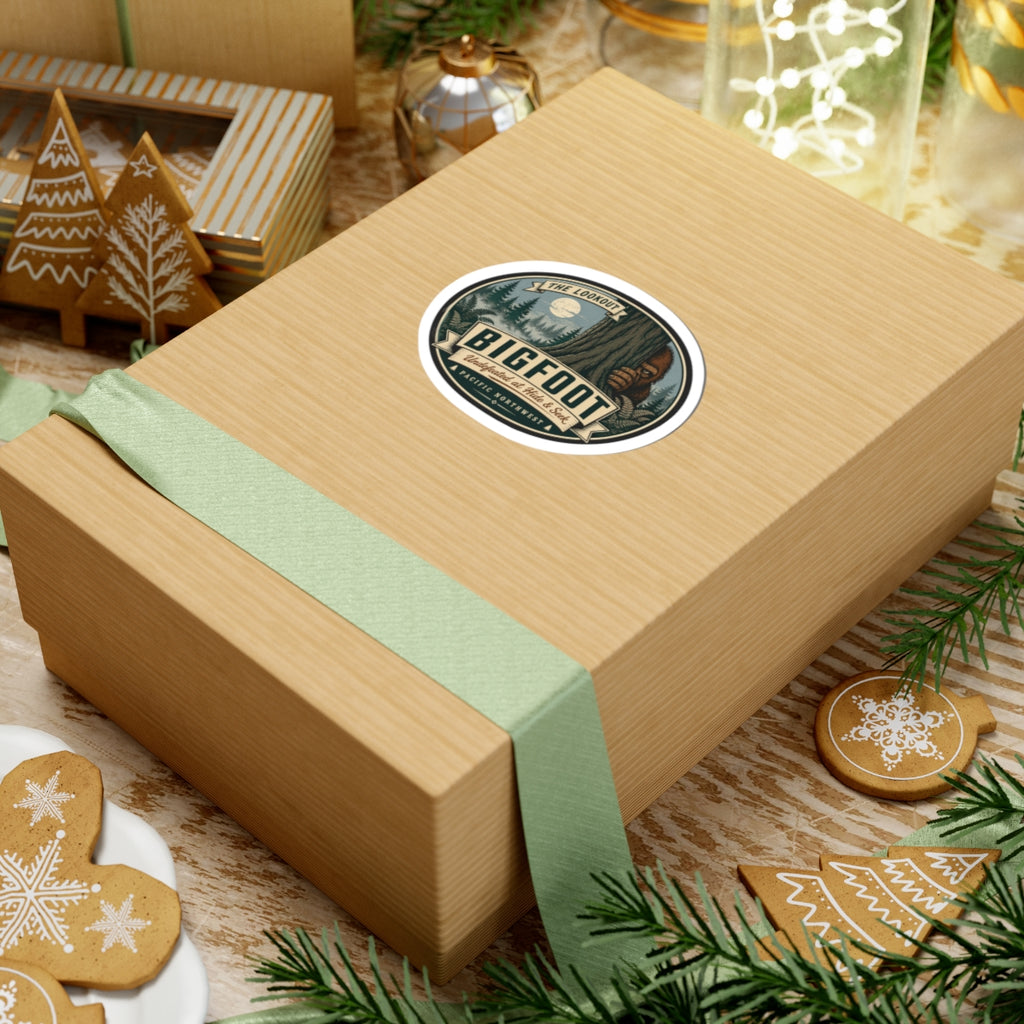 Round kiss-cut Bigfoot outdoor logo vinyl sticker on tan gift box with ribbon