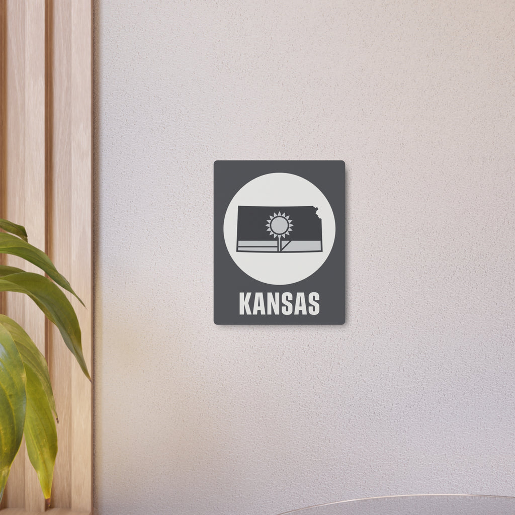 Small dark gray Kansas metal wall sign featuring sunburst icon and 'KANSAS' in white