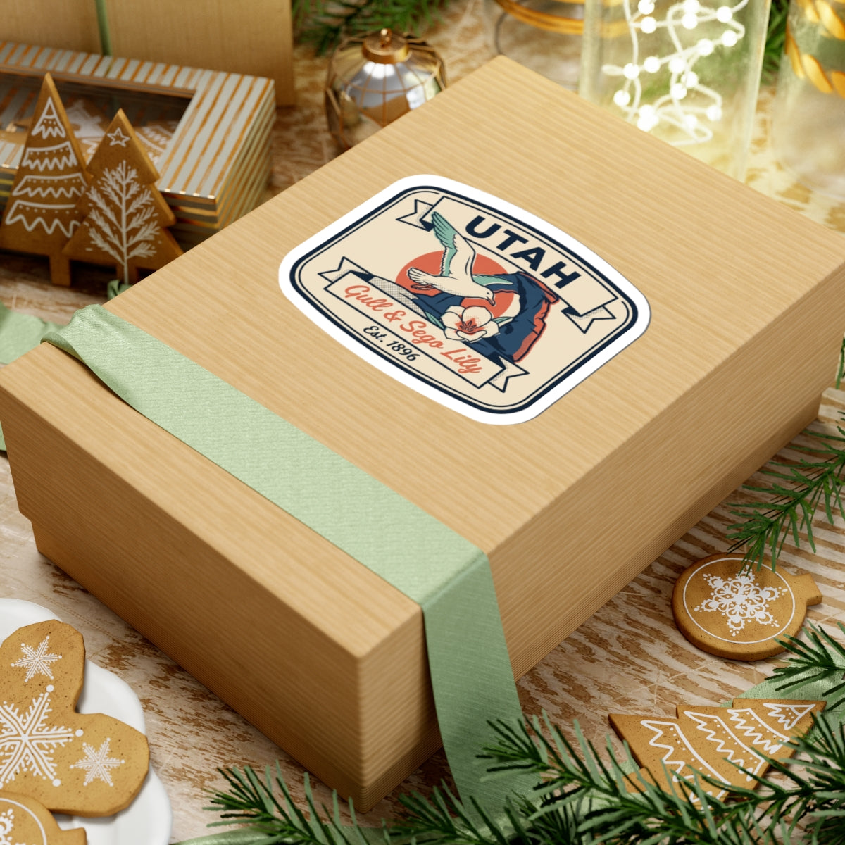 Utah badge sticker on wrapped gift box; vintage gull and sego lily artwork
