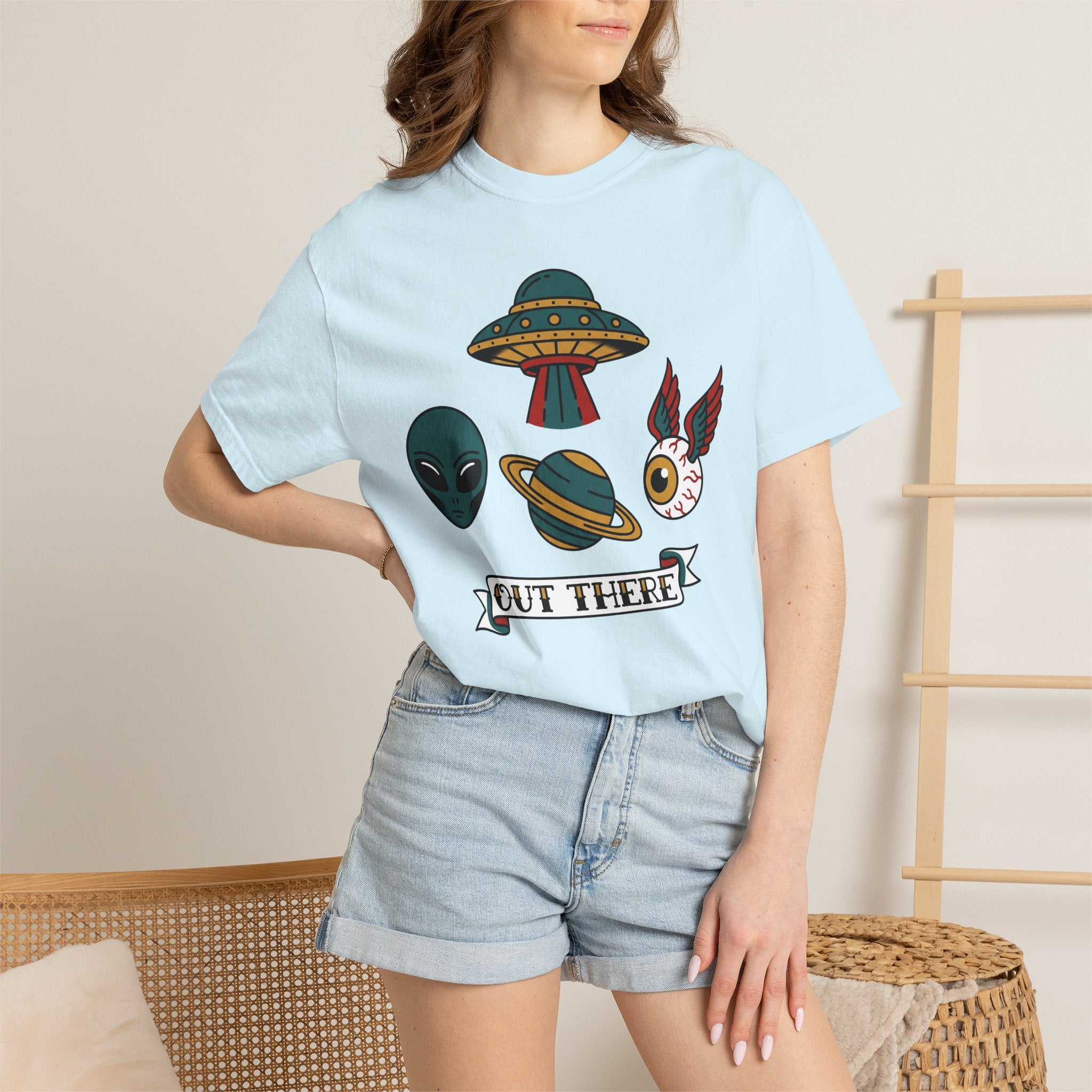 Light blue crew-neck T-shirt with UFO and alien graphic on model